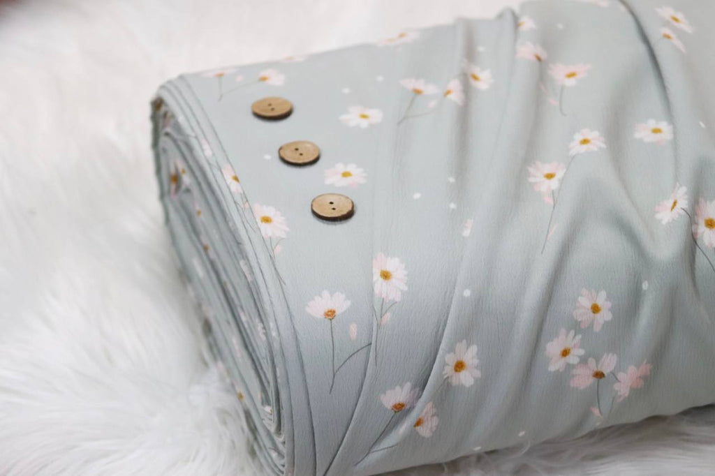 Pineskin Aqua Dancing Daisy 
by the half yard
