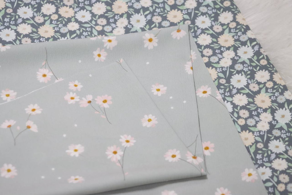 Pineskin Aqua Dancing Daisy 
by the half yard